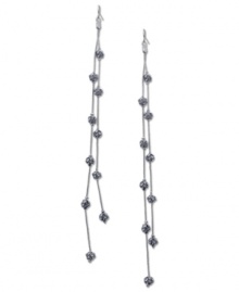 Fire up your evening with these two-row linear earrings from GUESS. Crystal-embellished fireballs hang from metal chains. Crafted in imitation rhodium tone mixed metal. Approximate drop: 7 inches.