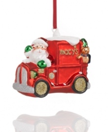 Rudolph and his reindeer pals take a break as Santa speeds the Macy's Christmas truck through the snow. A teddy bear co-pilot rides in the back. Rudolph and his reindeer pals take a break as Santa speeds the Macy's Christmas truck through the snow. A teddy bear co-pilot rides in the back.