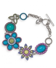 Infuse your look with a springtime touch. Carolee's breezy bracelet features an intricate floral pattern with plastic beading in bright blue and pastel hues. Crafted in silver tone mixed metal with a toggle and bar clasp. Approximate 7-3/4 inches.