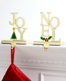 Hang Christmas stockings in the spirit of the season with goldtone metal Joy and Noel hooks for the mantel. With colorful tree or holly detail. (Clearance) Hang Christmas stockings in the spirit of the season with goldtone metal Joy and Noel hooks for the mantel. With colorful tree or holly detail. (Clearance)