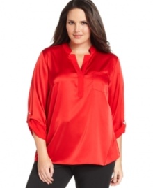 Dress up your casual bottoms with Calvin Klein's roll-tab sleeve plus size top.