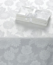 Ready for anything. With a tablecloth and napkins for up to eight guests, this Dinner Party Medley table linens set offers efficiency for the busy host and a classic white floral motif to make any meal elegant. Ready for anything. With a tablecloth and napkins for up to eight guests, this Dinner Party Medley table linens set offers efficiency for the busy host and a classic white floral motif to make any meal elegant.