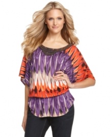 Spice up your look with a beaded tunic top from INC! The vibrant colors and lively print give it eye-catching appeal. Spice up your look with a beaded tunic top from INC! The vibrant colors and lively print give it eye-catching appeal.