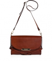 With equestrian-inspired strapping and sleek dark tan leather, Burberry Londons crossbody bag lends an ultra-sophisticated polish to your look - Flap with logo engraved plaque, removable buckled shoulder strap, check lining, inside zippered back wall pocket, front wall slot pockets - Wear with tailored outerwear or an iconic Burberry trench With equestrian-inspired strapping and sleek dark tan leather, Burberry Londons crossbody bag lends an ultra-sophisticated polish to your look - Flap with logo engraved plaque, removable buckled shoulder strap, check lining, inside zippered back wall pocket, front wall slot pockets - Wear with tailored outerwear or an iconic Burberry trench