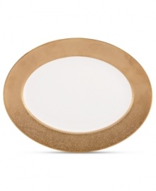 Make any occasion memorable with Gold Dust dinnerware. Combining the urbane style of Donna Karan with the renowned craftsmanship of Lenox, this timeless bone china oval platter radiates luxury with a wide band of matte-textured gold. Make any occasion memorable with Gold Dust dinnerware. Combining the urbane style of Donna Karan with the renowned craftsmanship of Lenox, this timeless bone china oval platter radiates luxury with a wide band of matte-textured gold.