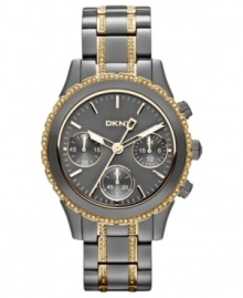 Dusky gunmetal tones blend impeccably with golden accents on this DKNY watch. Dusky gunmetal tones blend impeccably with golden accents on this DKNY watch.