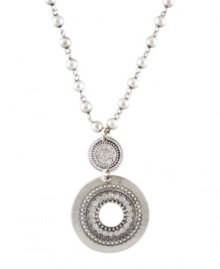 Channel your inner bohemian diva. This hippie-chic pendant by Jessica Simpson features two intricate discs suspended from a delicate beaded chain. Crafted in worn silver tone mixed metal. Approximate length: 18 inches. Approximate drop: 1-1/2 inches. Channel your inner bohemian diva. This hippie-chic pendant by Jessica Simpson features two intricate discs suspended from a delicate beaded chain. Crafted in worn silver tone mixed metal. Approximate length: 18 inches. Approximate drop: 1-1/2 inches.