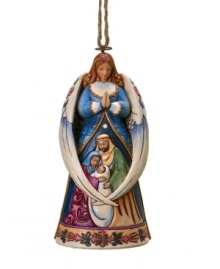 Jim Shore's angel and Holy Family ornament inspires a moment of quiet reflection on the true spirit of Christmas.