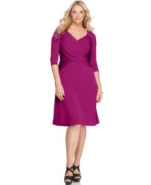 Look sensational and slender with Elementz' three-quarter sleeve plus size dress, featuring a slimming panel inset and an A-line shape.