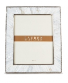 Enhance the look of any photo when framed in the beauty of Mother of Pearl. A slim line of carved steel trim surrounds this natural composition with classic style, only from Lauren by Ralph Lauren.