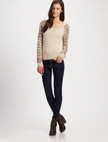 The classic crewneck features chic Fair Isle knit sleeves.CrewneckRaglan sleevesRibbed trimPullover styleAbout 22 from shoulder to hem70% acrylic/20% wool/10% alpacaDry cleanImportedModel shown is 5'10 (177cm) wearing US size Small.