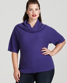 Dazzling crystal buttons on the sleeve lend a touch of glamour to the relaxed silhouette of this Jones New York Collection cashmere sweater. Dazzling crystal buttons on the sleeve lend a touch of glamour to the relaxed silhouette of this Jones New York Collection cashmere sweater.