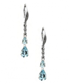 Take your special occasion style to a whole new level. Judith Jack's stunning drop earrings feature two pear-cut blue topaz (3-5/8 ct. t.w.) and glittering marcasite (1/5 ct. t.w.). Set in sterling silver. Approximate drop: 1-3/4 inches. Take your special occasion style to a whole new level. Judith Jack's stunning drop earrings feature two pear-cut blue topaz (3-5/8 ct. t.w.) and glittering marcasite (1/5 ct. t.w.). Set in sterling silver. Approximate drop: 1-3/4 inches.
