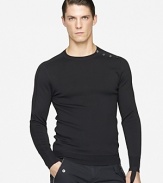 Defined by a trim, contemporary fit, a long-sleeved sweater is knit from luxe merino wool yarns and finished with sleek buttons along the left shoulder.