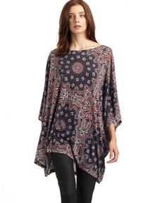 THE LOOKBateau necklinePullover styleCape style dolman sleeves Paisley printAsymmetrical hemTHE FITAbout 34 from shoulder to longest point of hemTHE MATERIALModalCARE & ORIGINMachine washImported