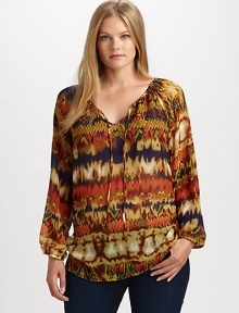 A vibrantly printed design with a self-tie neckline and a relaxed fit that will flatter your shape. Self-tie detail at necklineLong sleevesElasticized cuffsAllover printContrasting trimBack yokeAbout 27 from shoulder to hemPolyesterDry cleanImported