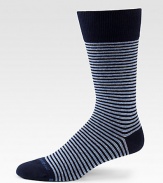 A distinguished stripe pattern is offset by a solid top trim and shaped in a soft cotton blend.Mid-calf height70% cotton/28% polyester/2% elasticMachine washImported