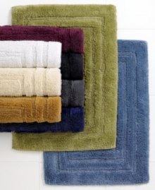 Treat your feet with these these plush bath rugs from Lauren by Ralph Lauren, featuring ringspun cotton and viscose fiber from bamboo and a triple racetrack design. Choose from a variety of colors to complement any bath décor.