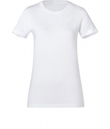 This tee made of fine, white cotton is a closet essential - Wonderfully soft and comfortable on the skin - Narrow-waisted silhouette, with round neck and short sleeves - Long cut - Great for the office as a layering piece, or on the weekends with jeans, skirts or leggings