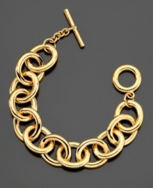 This gleaming goldtone bracelet by Lauren by Ralph Lauren is crafted in mixed metal with a bar and toggle closure. Approximate length: 7-1/2 inches.