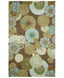 Like impressionist art, the Disco Driftwood rug from the Ravella collection is all about movement. Mod-inspired blooms and pinwheel shapes twirl across the rug, imparting vivacious character. Sky blues, hazelnuts and soft greens enhance any space. UV-stabilized polypropylene/acrylic blend offers the look of natural fibers but resists fading and wear, making the rug perfect for patios, kitchens or any indoor/outdoor area in need of a style boost.