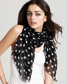 Go for ladylike style with a sheer lightweight scarf in a classic polka dot print from Lauren Ralph Lauren.