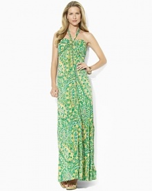 A vibrant sweeping pattern enlivens a breezy maxi dress, rendered in sleek jersey with a halter neckline.