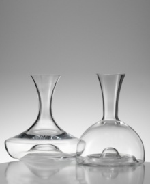 Marrying the finest modern innovations with graceful contemporary style, this dramatic decanter (shown left) is a lavish treat for any wine. An inward curved base allows carafe to be gripped from the body for ease of pouring, while Eisch's trademarked No Drop Effect© keeps wine from dripping outside the decanter. Holds 50 oz. (Clearance) Marrying the finest modern innovations with graceful contemporary style, this dramatic decanter (shown left) is a lavish treat for any wine. An inward curved base allows carafe to be gripped from the body for ease of pouring, while Eisch's trademarked No Drop Effect© keeps wine from dripping outside the decanter. Holds 50 oz. (Clearance)