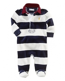 A comfortable footed coverall in plush velour features a preppy rugby stripe and collar for a timeless sporty look. A comfortable footed coverall in plush velour features a preppy rugby stripe and collar for a timeless sporty look.