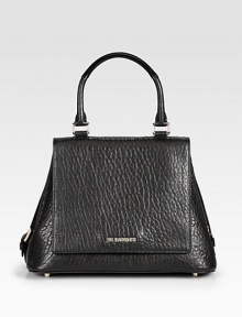 An beautiful shape in soft pebbled, lambskin leather.Top handle, 5½ dropMagnetic snap flap closureSnap button gussetsThree inside open pocketsLeather lining12W X 8½H X 6½DMade in Italy An beautiful shape in soft pebbled, lambskin leather.Top handle, 5½ dropMagnetic snap flap closureSnap button gussetsThree inside open pocketsLeather lining12W X 8½H X 6½DMade in Italy