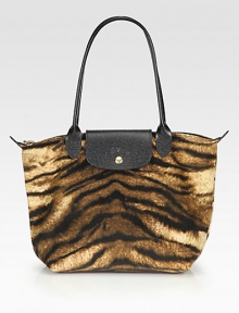 An exotic, animal printed velvet cotton style with leather accents, perfect for travel or everyday.Double leather top handles, 4½ dropTop zip closure with snap button flapOne inside open pocketFully lined9¾W X 9¾H X 5½DImported An exotic, animal printed velvet cotton style with leather accents, perfect for travel or everyday.Double leather top handles, 4½ dropTop zip closure with snap button flapOne inside open pocketFully lined9¾W X 9¾H X 5½DImported