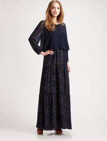 A long tiered silhouette and attached sheer blouse lend this style a whimsical aesthetic.Two-piece dress Long sleeves Pintuck detailing Button-down back Long tiered skirt About 58 from shoulder to hem Polyester Machine wash Imported