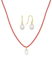 Casual chic. This pendant and earrings set from Majorica pops with organic man-made pearls (9 mm). The red cord necklace adds a touch of whimsy. Crafted in gold tone mixed metal. Approximate length: 16 to 18 inches. Approximate drop: 1/2 inch.