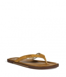 Inject sophisticated summer-ready style to your look with these leather sandals from UGG Australia - Classic thong style, textured leather strap - Pair with shorts, a short sleeve button down, and a straw fedora Inject sophisticated summer-ready style to your look with these leather sandals from UGG Australia - Classic thong style, textured leather strap - Pair with shorts, a short sleeve button down, and a straw fedora