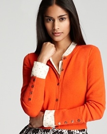 With a chic, cropped silhouette, this Magaschoni cardigan lends itself to high-waisted trousers and sleek shifts for classic feminine polish. With a chic, cropped silhouette, this Magaschoni cardigan lends itself to high-waisted trousers and sleek shifts for classic feminine polish.