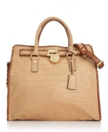 This stunning design by MICHAEL Michael Kors puts a modern spin on the classic satchel. Crocodile print leather, whipstitch detailing and polished goldtone accents make this gorgeous style ideal for business or pleasure. This stunning design by MICHAEL Michael Kors puts a modern spin on the classic satchel. Crocodile print leather, whipstitch detailing and polished goldtone accents make this gorgeous style ideal for business or pleasure.