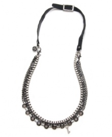 Biker chick meets industrial chic. This stately four layer necklace by Material Girl has extra bite. A traditional box chain and two darker link chains combine together with a sparkling strand of smokey quartz-colored crystals on a leather strap backing with a belt clasp. Necklace set in mixed metal and features crystal fireball, crystal key, and logo charm accents. Approximate length: 36 inches.