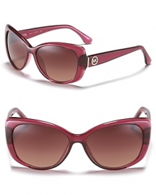 In a chic pink hue, these MICHAEL Michael Kors cat eye sunglasses showcase the on-trend shape with feminine flair.