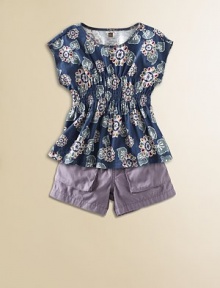 The striking floral pattern of this sweet, soft knit top is inspired by the markets of Bali.Round band necklineCap sleevesWide smocked waistCottonMachine washImported The striking floral pattern of this sweet, soft knit top is inspired by the markets of Bali.Round band necklineCap sleevesWide smocked waistCottonMachine washImported