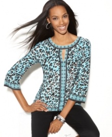 Get an effortless exotic look with this petite tunic by INC, featuring a keyhole neckline and transporting print. Get an effortless exotic look with this petite tunic by INC, featuring a keyhole neckline and transporting print.