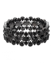 Startling glamour with a hint of mystery. Monet bracelet features an intricate pattern highlighting bold jet black crystals in a mixed metal setting. Bracelet stretches to fit wrist. Approximate diameter: 2-1/4 inches.