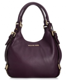 Elegant and on-trend, this take-anywhere shoulder tote from MICHAEL Michael Kors is the accessory of the season. Soft leather is adorned with golden buckle and stud accents, while the roomy interior provides three separate compartments to keep you organized on-the-go. Elegant and on-trend, this take-anywhere shoulder tote from MICHAEL Michael Kors is the accessory of the season. Soft leather is adorned with golden buckle and stud accents, while the roomy interior provides three separate compartments to keep you organized on-the-go.