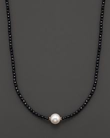 Black onyx beaded necklace with a single freshwater pearl. Black onyx beaded necklace with a single freshwater pearl.