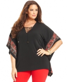 Lace-up a stylish look with MICHAEL Michael Kors' batwing sleeve plus size top, punctuated by a border print.