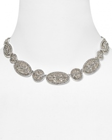 Classic and chic. Nadri's linked collar necklace epitomizes statement sparkle, accented with ornate crystals and rhodium links. Classic and chic. Nadri's linked collar necklace epitomizes statement sparkle, accented with ornate crystals and rhodium links.