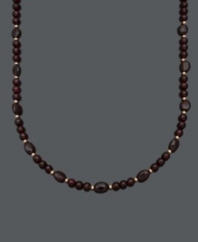 Sophistication in rich red hues. Set off your look with this beautiful necklace highlighting 6 millimeter and 6 x 8 millimeter garnet beads (150 ct. t.w.) and 14k gold accent beads and clasp. Approximate length: 18 inches. Sophistication in rich red hues. Set off your look with this beautiful necklace highlighting 6 millimeter and 6 x 8 millimeter garnet beads (150 ct. t.w.) and 14k gold accent beads and clasp. Approximate length: 18 inches.