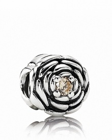 Pandora's delicately carved sterling silver rose charm features a sparking champagne zirconia center.