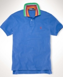 A classic short-sleeved polo shirt is cut for a trim, modern fit in smooth, soft cotton interlock.