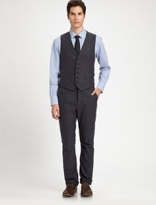Add a finishing touch to a suit ensemble or a tailored structure to any casual look with this impeccably shaped, button-up vest, rendered in soft cotton for a handsomely modern feel.Button-frontWaist flap pocketsCottonDry cleanMade in USA Add a finishing touch to a suit ensemble or a tailored structure to any casual look with this impeccably shaped, button-up vest, rendered in soft cotton for a handsomely modern feel.Button-frontWaist flap pocketsCottonDry cleanMade in USA