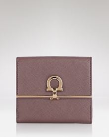 Pulled together perfection starts with practical accessories like this leather wallet from Salvatore Ferragamo. It's a beautiful accompaniment for every look with plenty of pockets to keep the essentials in place. Pulled together perfection starts with practical accessories like this leather wallet from Salvatore Ferragamo. It's a beautiful accompaniment for every look with plenty of pockets to keep the essentials in place.